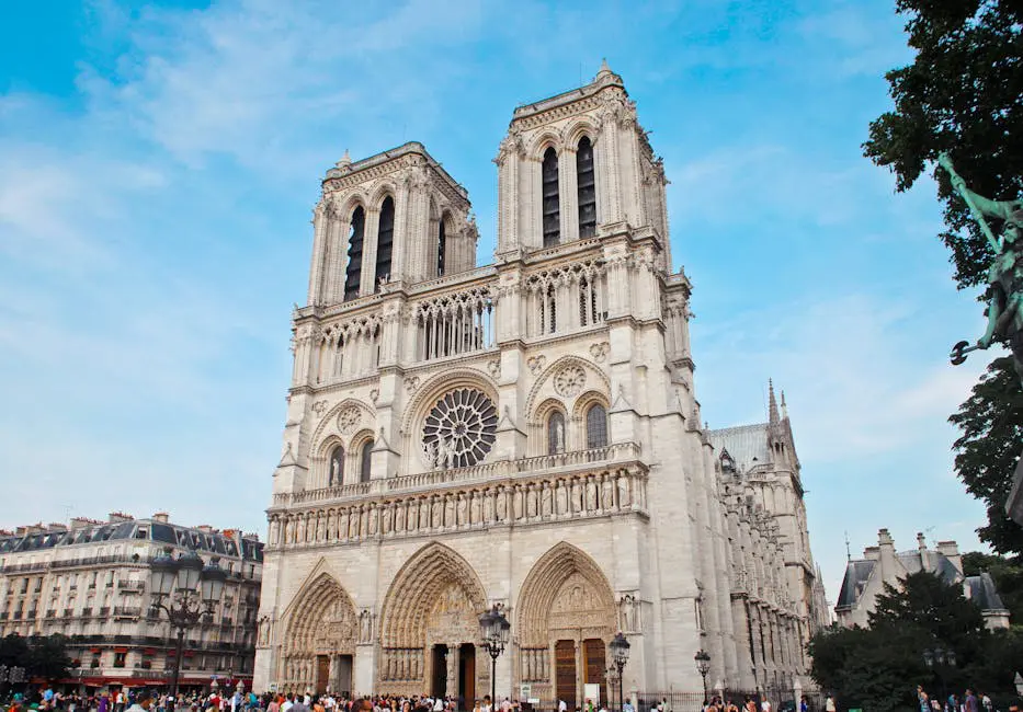The historic Notre-Dame Cathedral in Paris, France, standing tall against a bright sky, representing culture and heritage for expats in France.