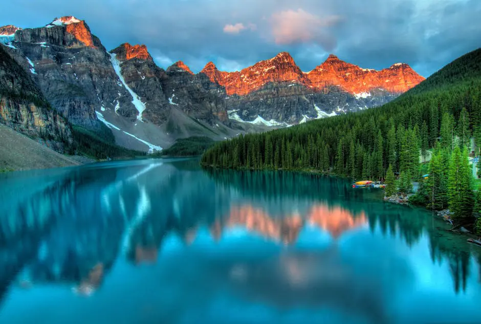 Scenic view of Moraine Lake with the Canadian Rockies reflecting on the turquoise water, representing the natural beauty and tranquility of Canada.