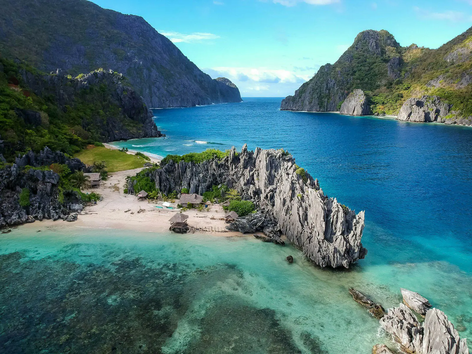 Aerial view of El Nido, Palawan, Philippines showing turquoise sea and limestone cliffs, a popular expat and travel destination.