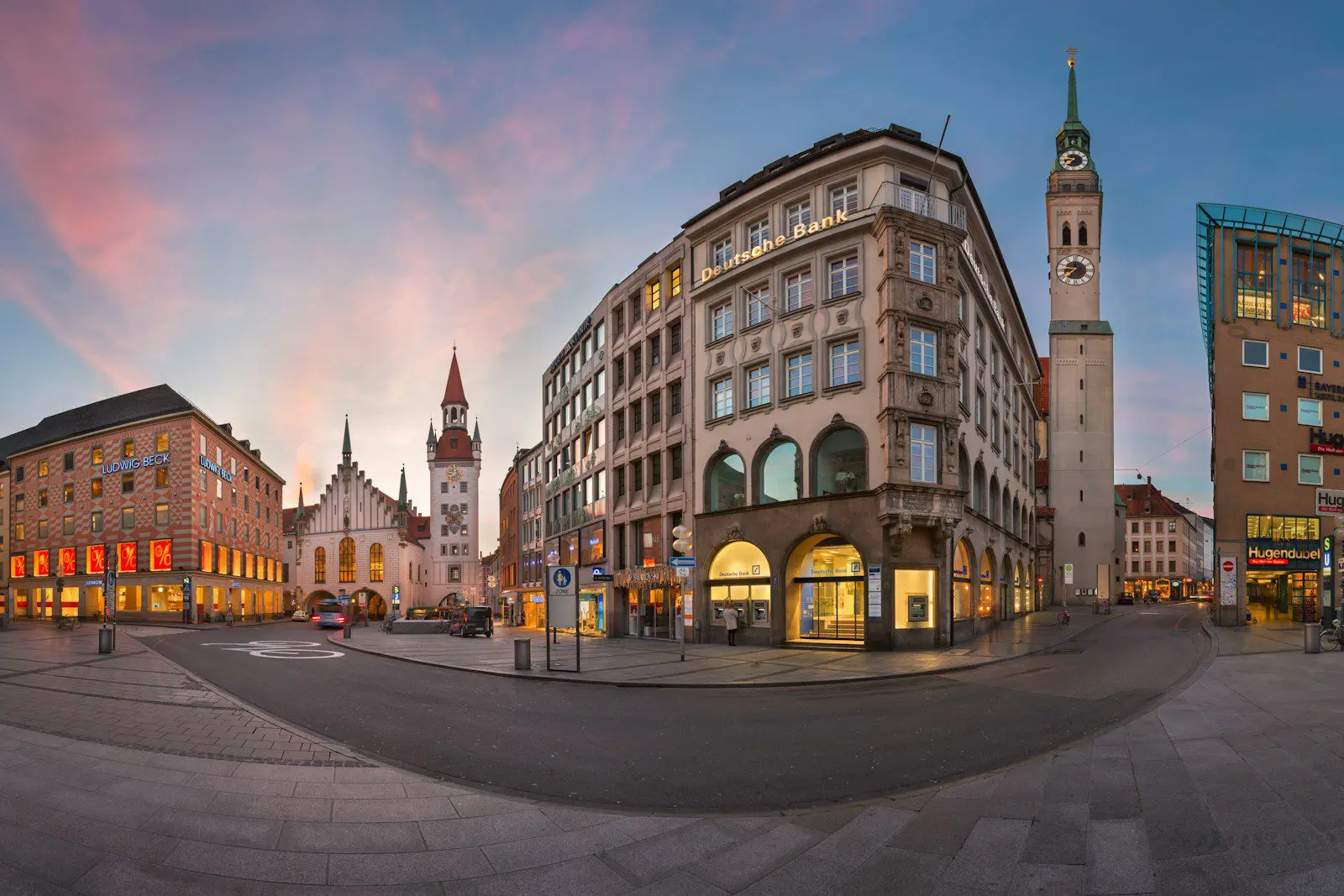 Munich city center at sunset showing historic buildings, Deutsche Bank, and Marienplatz architecture, representing expat life and relocation in Germany.