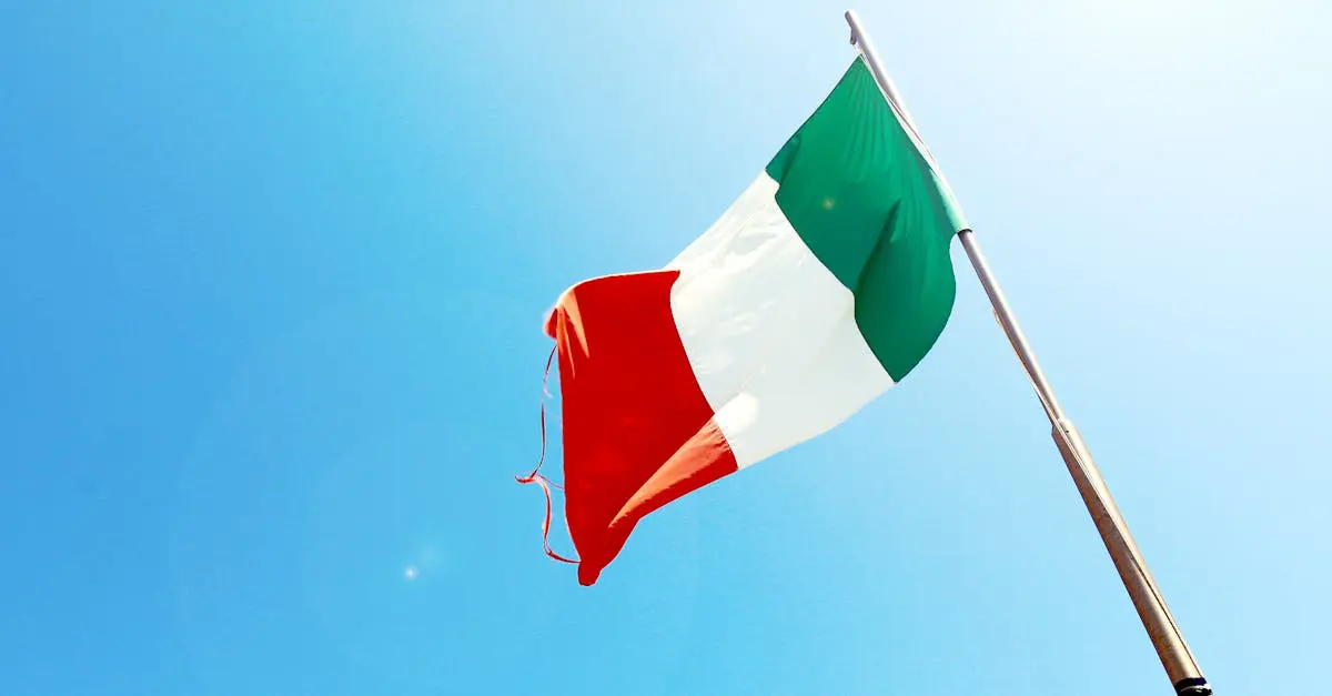 Italian national flag waving in the wind against a bright blue sky, symbolizing Italy’s culture and identity.