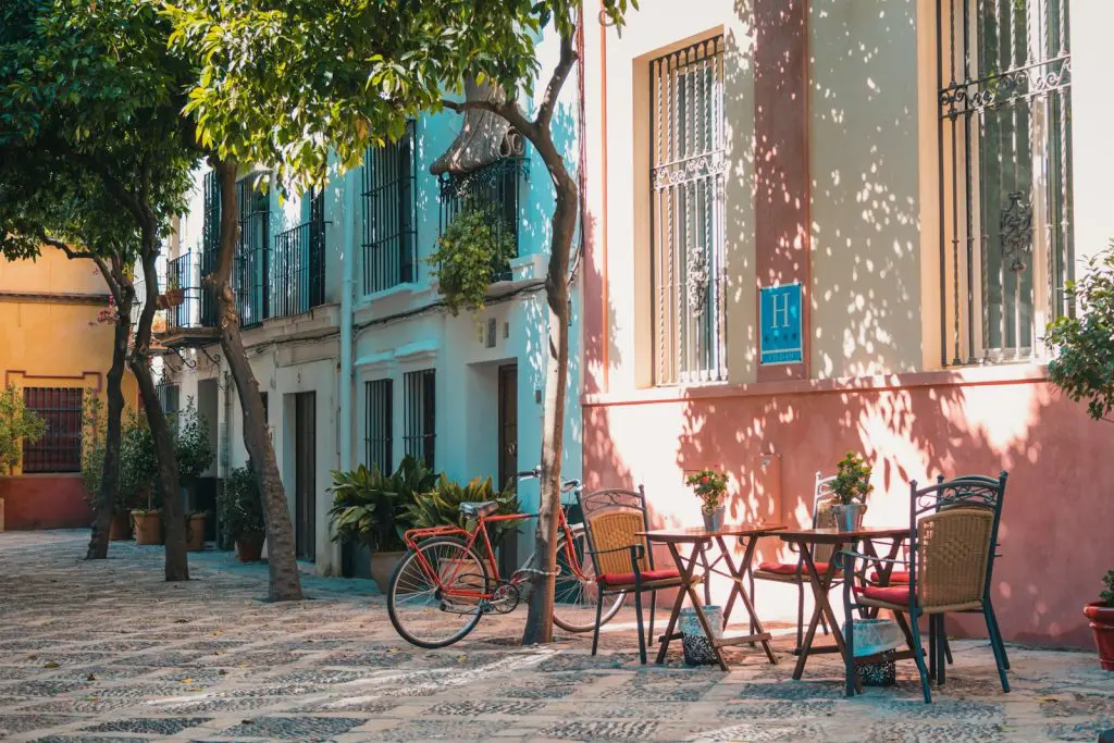 Photo by Johan Mouchet thinking of retiring abroad - lovely outdoor café, representing lifestyle for expats living in Spain.