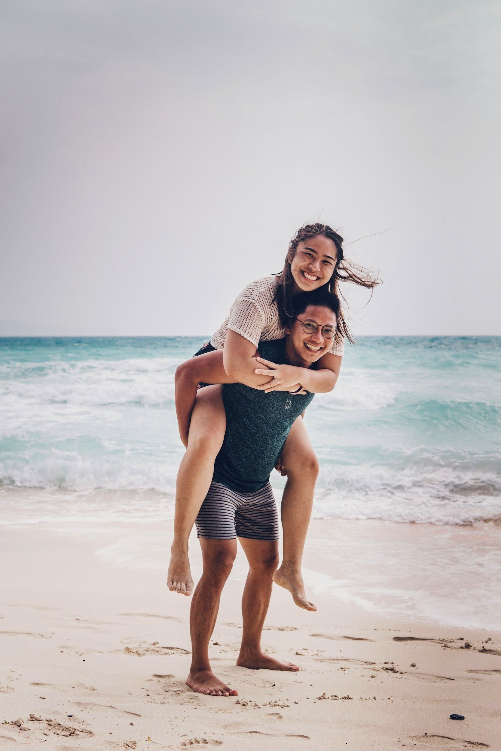 Happy expat couple with international health insurance