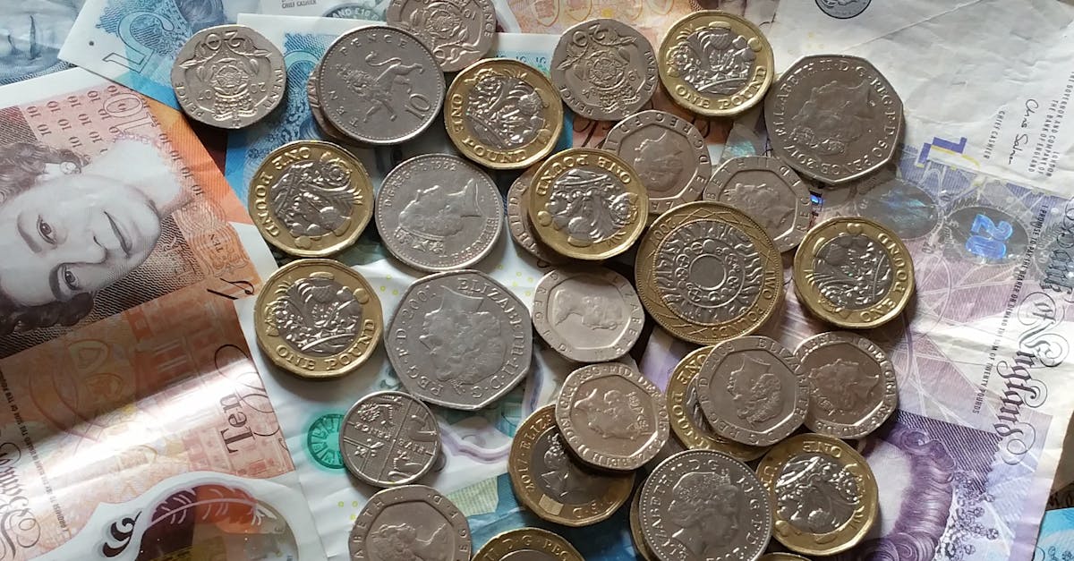 pexels-photo-5277952-5277952 A detailed image of British Pound Sterling coins and banknotes, perfect for finance-related projects.