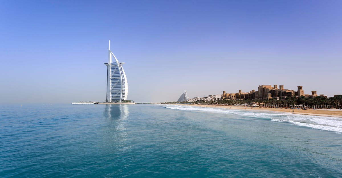 pexels-photo-823696-823696 Iconic Burj Al Arab overlooking the pristine Dubai beach, perfect for travel and leisure.