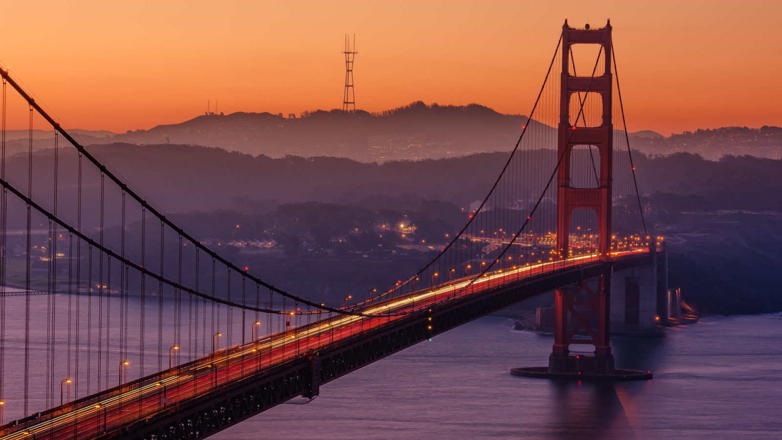 Photo by Evgeny Tchebotarev Golden Gate Bridge during sunset